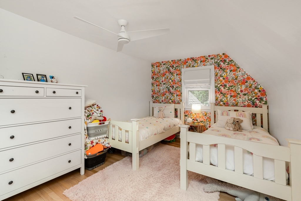 145 Pond Brook Road Newton, MA 02467 - Photo 32 of 39 a bedroom with furniture and a baby crib