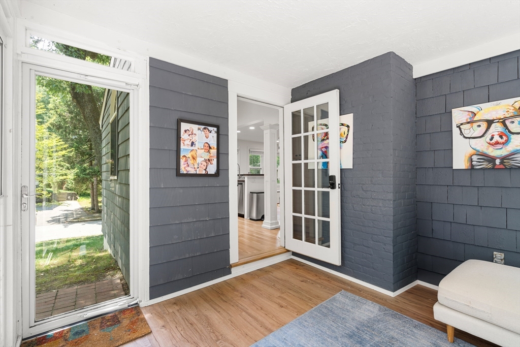 145 Pond Brook Road Newton, MA 02467 - Photo 34 of 39 a view of an entryway with wooden floor and door