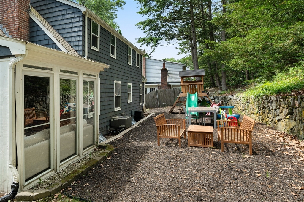 145 Pond Brook Road Newton, MA 02467 - Photo 37 of 39 a view of a house with backyard and sitting area