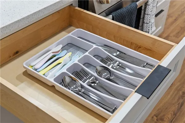 a kitchen with a refrigerator and cabinets