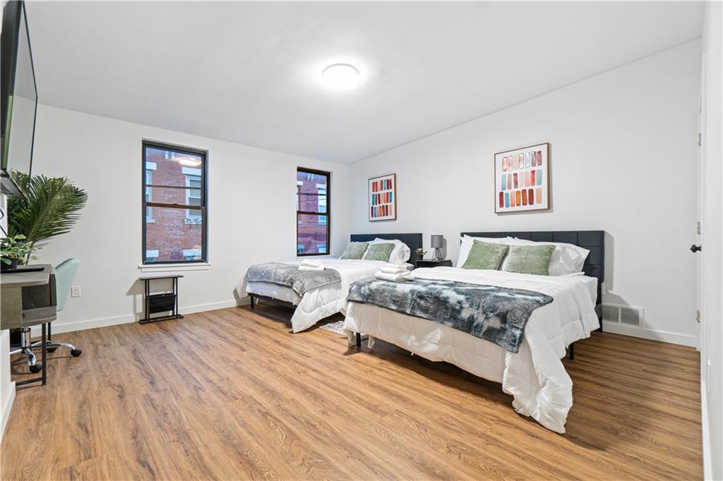 523 Alpine Avenue Pittsburgh, PA 15212 - Photo 22 of 29 a bedroom with a bed and a desk