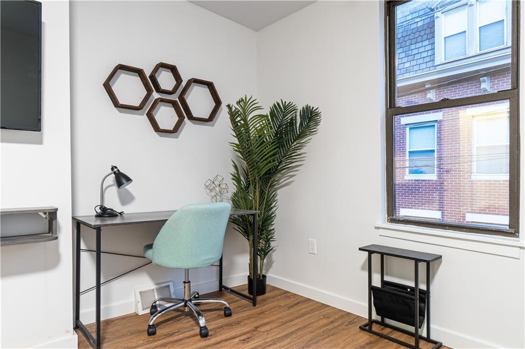 523 Alpine Avenue Pittsburgh, PA 15212 - Photo 24 of 29 a view of a livingroom with furniture and a potted plant