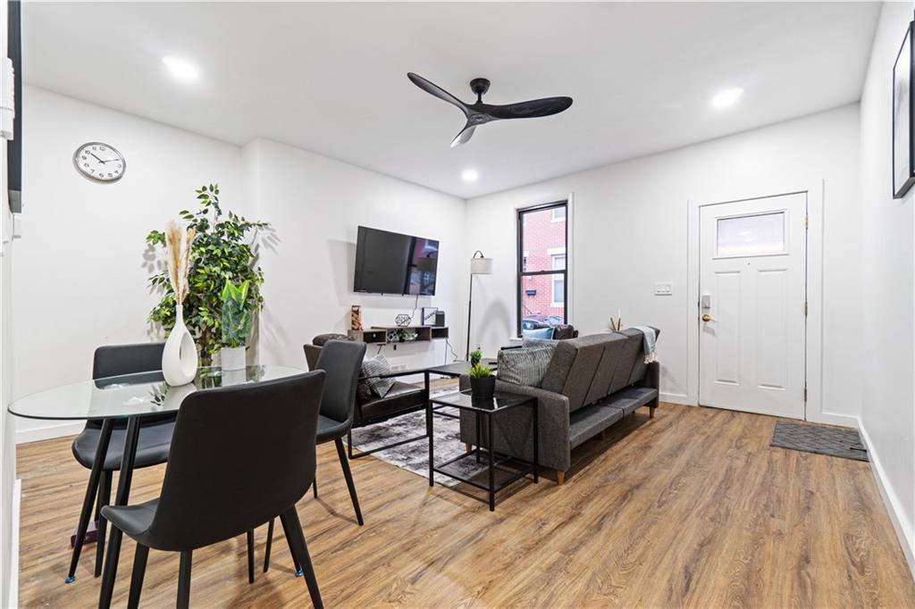 523 Alpine Avenue Pittsburgh, PA 15212 - Photo 4 of 29 a living room with furniture and a flat screen tv