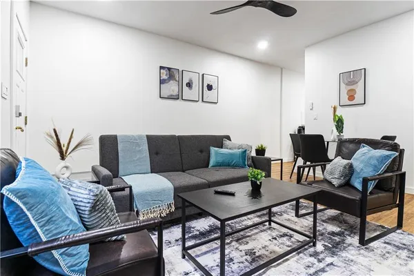 a view of a dining room with furniture and wooden floor