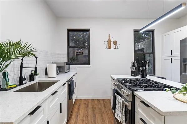 a kitchen with a table and chairs in it