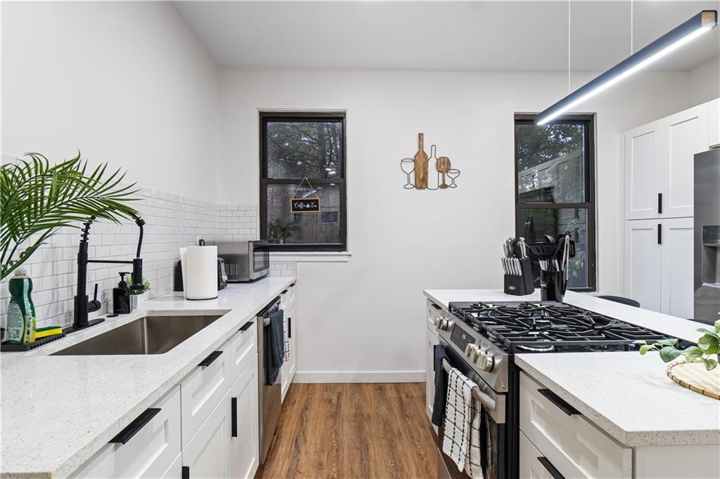 523 Alpine Avenue Pittsburgh, PA 15212 - Photo 9 of 29 a kitchen with a sink and stove