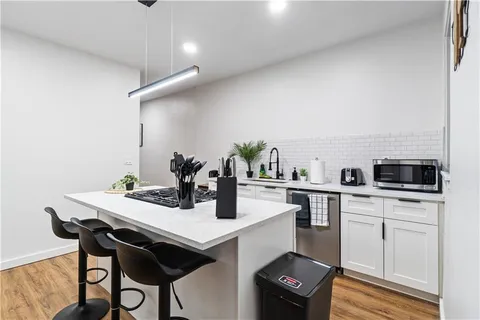 a room with storage and a fireplace