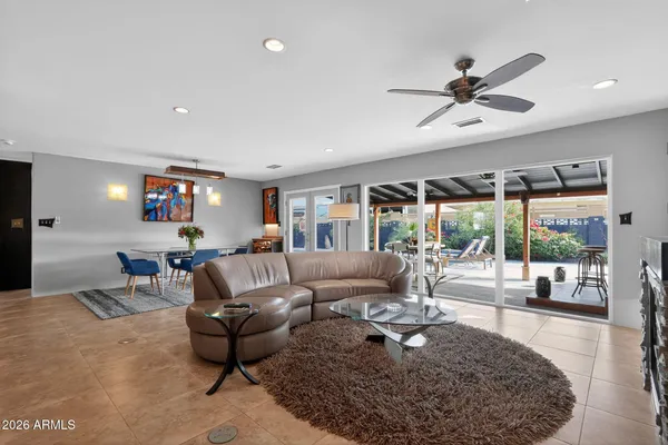a living room with furniture and a large window