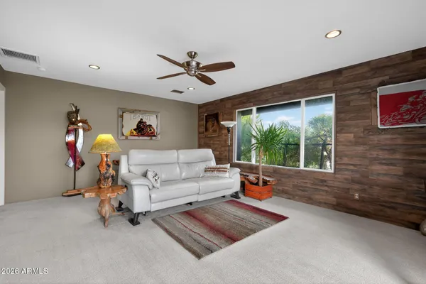 a bedroom with furniture and a window