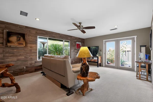 a living room with furniture and a large window