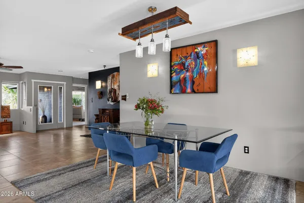 a view of a dining room with furniture wooden floor and a rug