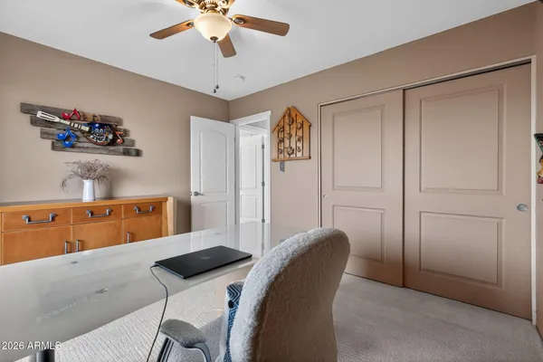 a balcony with table and chairs