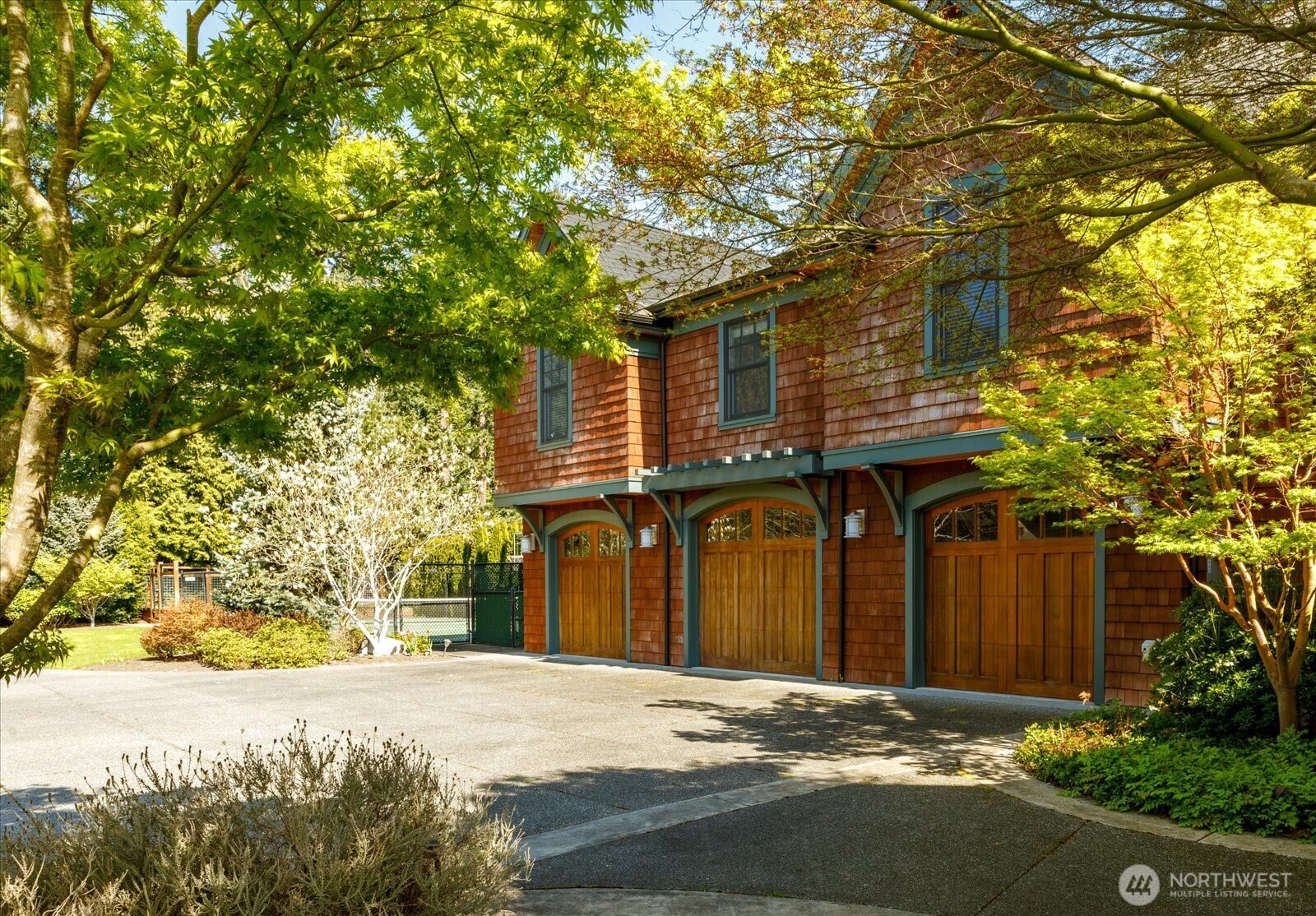 5848 Mutiny Bay Road Freeland, WA 98249 - Photo 15 of 40 a front view of a house with a yard and garage