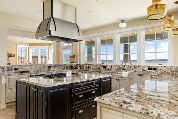 a kitchen with sink stove and cabinets