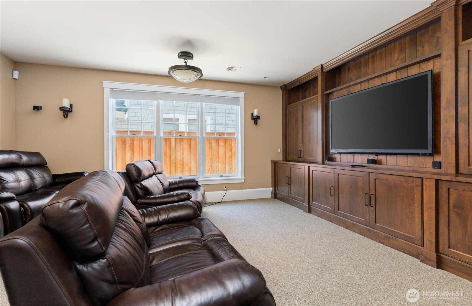 5848 Mutiny Bay Road Freeland, WA 98249 - Photo 29 of 40 a living room with furniture and a flat screen tv