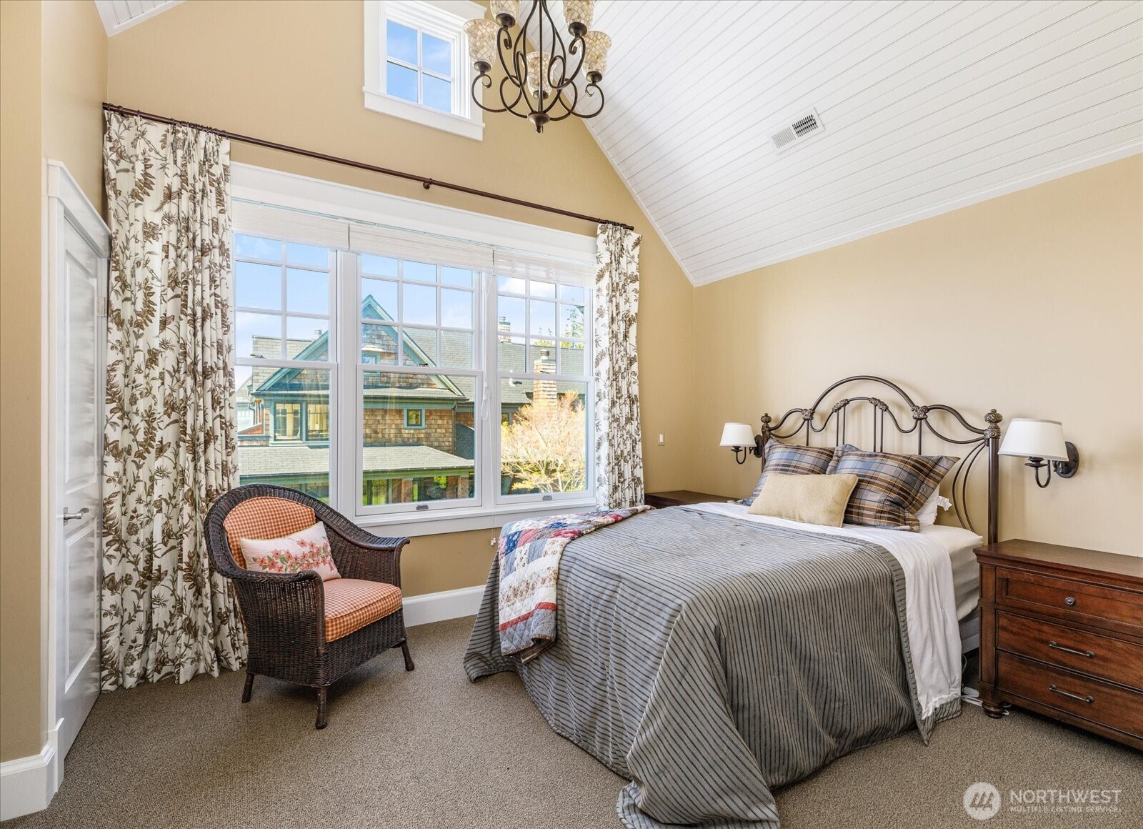 5848 Mutiny Bay Road Freeland, WA 98249 - Photo 38 of 40 a bedroom with a bed chair and a large window