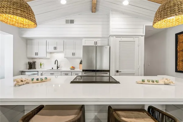 a kitchen with a stove and a cabinets