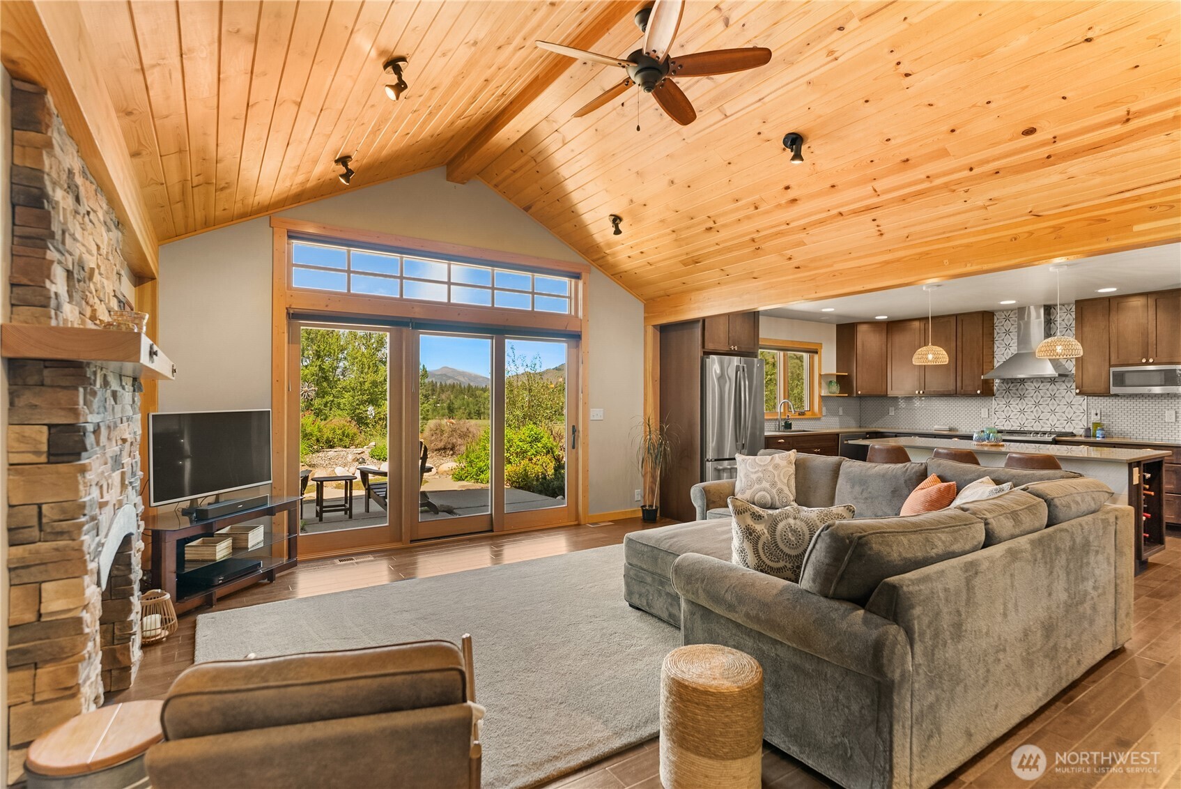 130 Sundown Road Winthrop, WA 98862 - Photo 9 of 40 a living room with furniture and a flat screen tv
