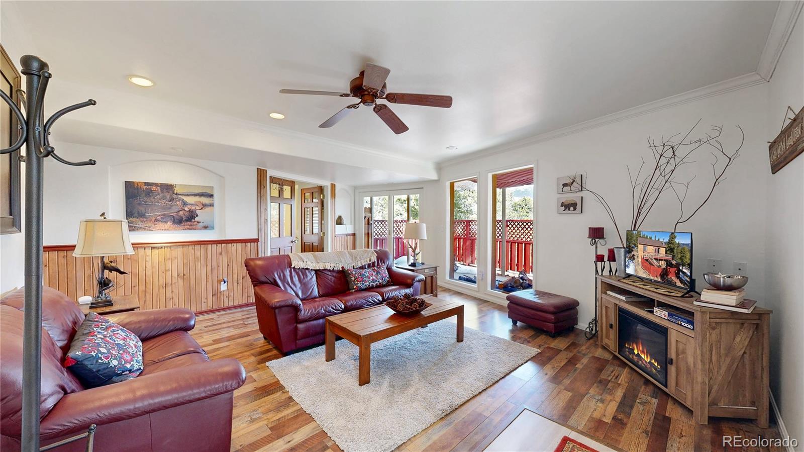 225 Rd P62 Bailey, CO 80421 - Photo 16 of 49 a living room with furniture and a flat screen tv