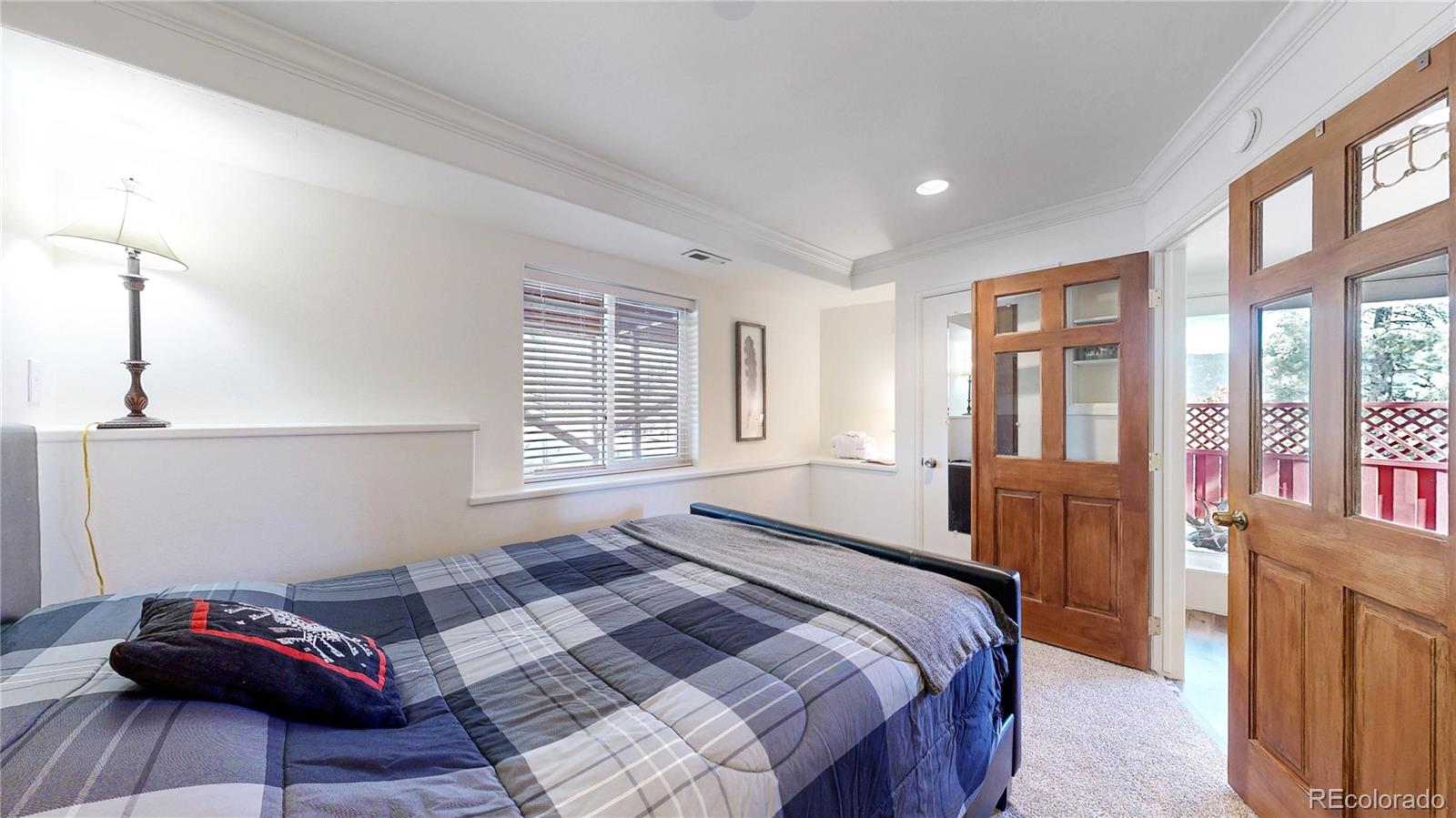 225 Rd P62 Bailey, CO 80421 - Photo 20 of 49 a bedroom with a bed and wooden floor