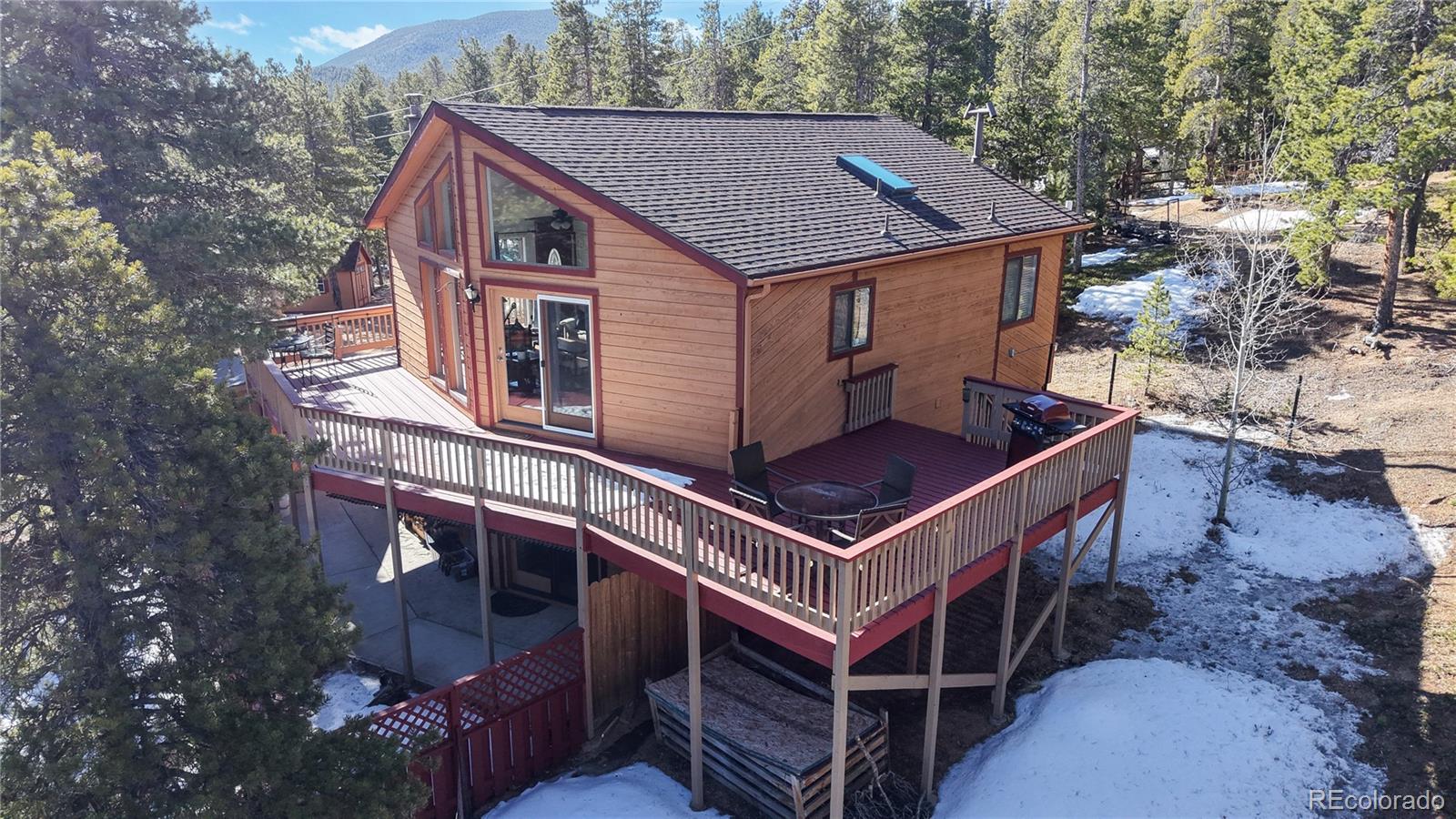 225 Rd P62 Bailey, CO 80421 - Photo 25 of 49 a aerial view of a house with a roof deck and a barbeque