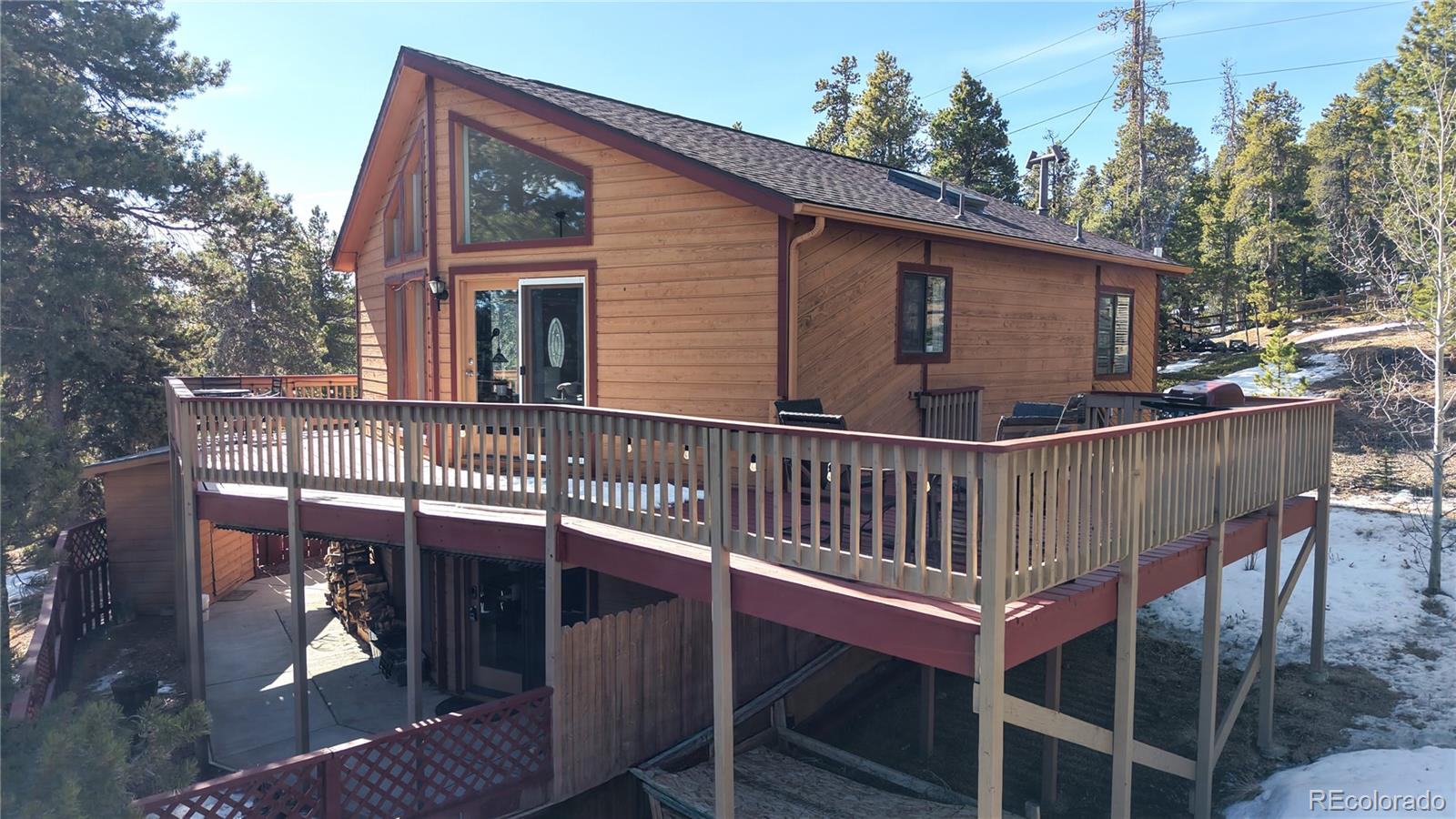 225 Rd P62 Bailey, CO 80421 - Photo 29 of 49 a view of a house with wooden deck front of house