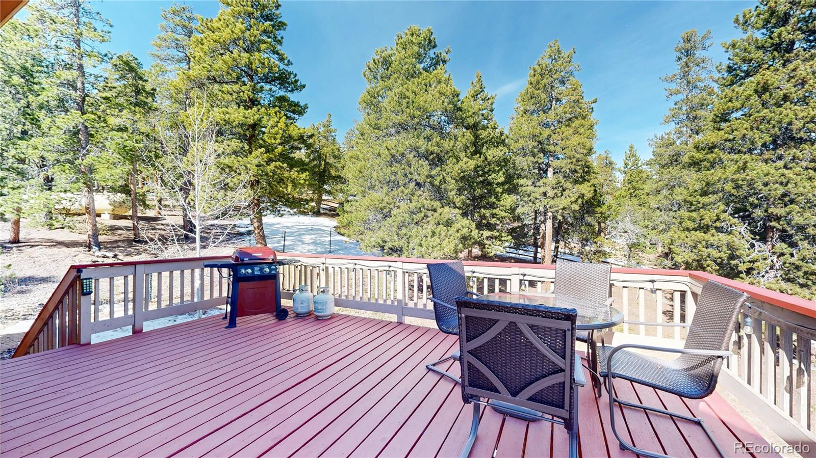 225 Rd P62 Bailey, CO 80421 - Photo 30 of 49 a view of a deck with furniture and trees