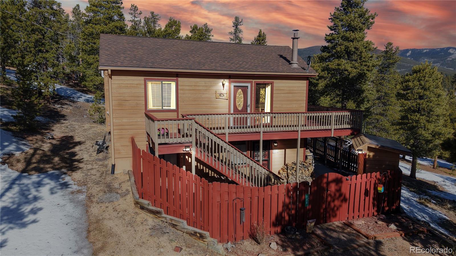 225 Rd P62 Bailey, CO 80421 - Photo 36 of 49 a view of a house with brick walls and wooden fence