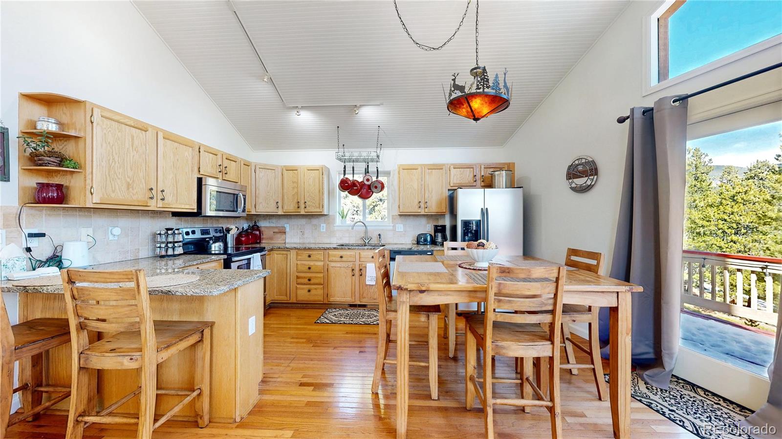 225 Rd P62 Bailey, CO 80421 - Photo 4 of 49 a view of kitchen and dining room with wooden floor