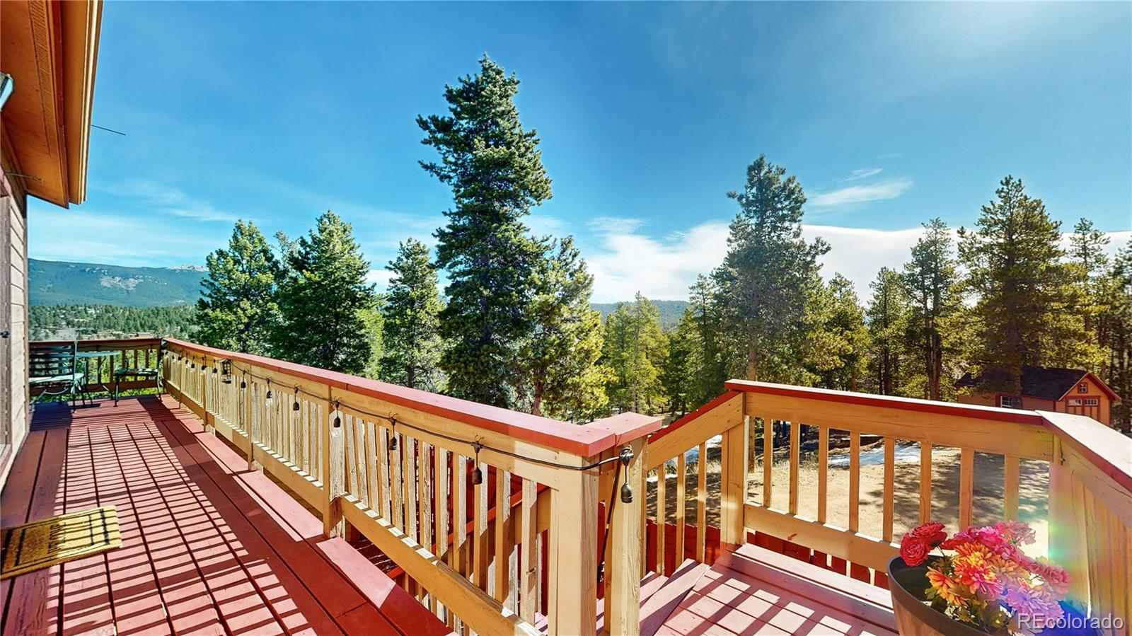225 Rd P62 Bailey, CO 80421 - Photo 42 of 49 a view of a balcony with wooden floor