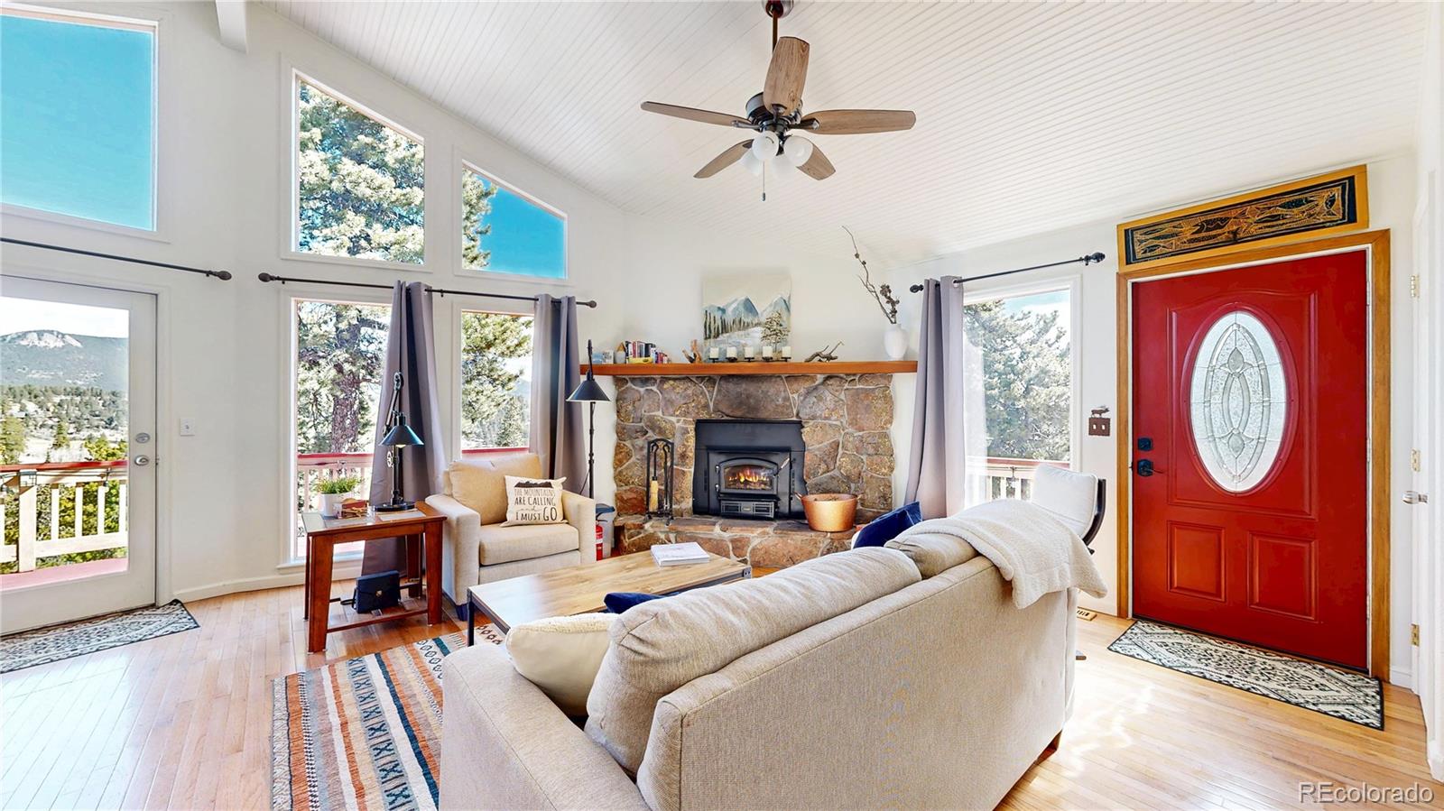 225 Rd P62 Bailey, CO 80421 - Photo 5 of 49 a living room with furniture a fireplace and a large window