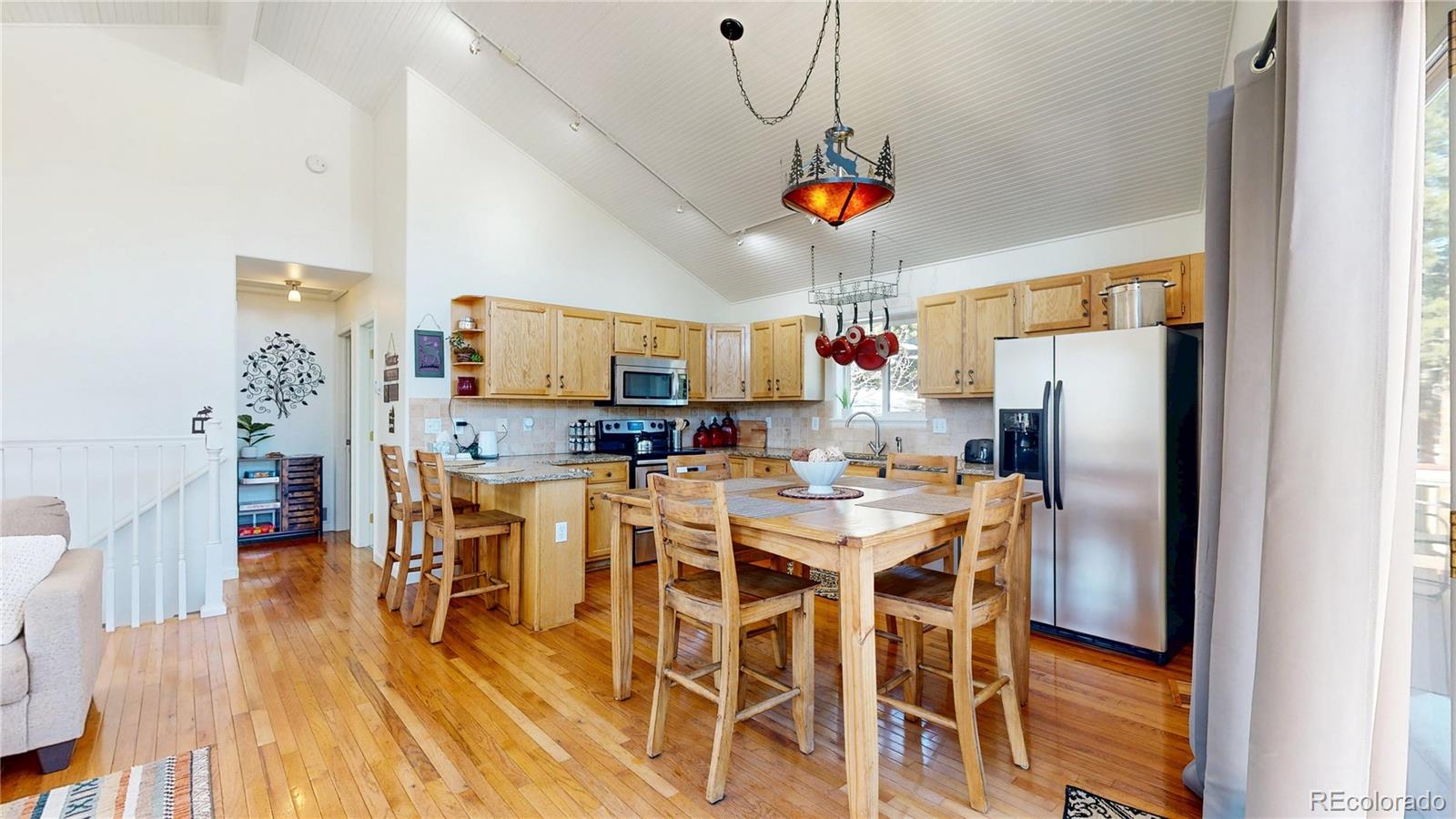 225 Rd P62 Bailey, CO 80421 - Photo 7 of 49 a view of a dining room with furniture window and wooden floor