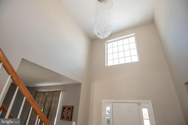 a bedroom with a bed and a table