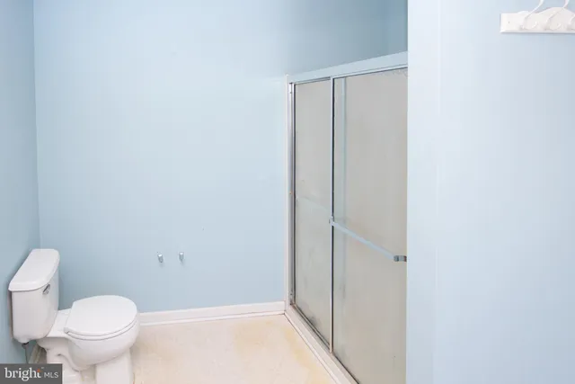 a bedroom with a bed and a mirror