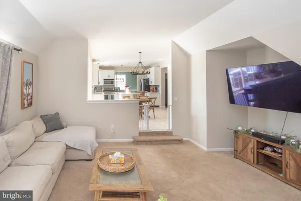 a kitchen with stainless steel appliances kitchen island granite countertop a sink and cabinets