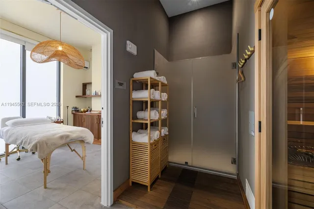 a bedroom with a bed and a mirror