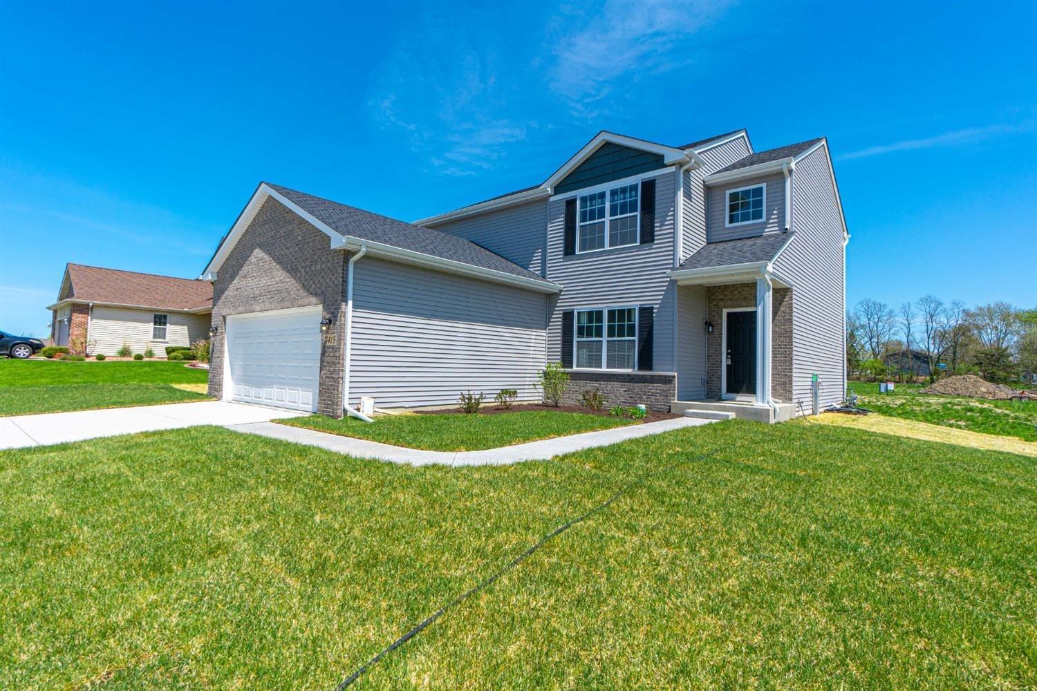 8665 Burr Rdg Circle Crown Point, IN 46307 - Photo 1 of 21 a front view of house with yard and green space
