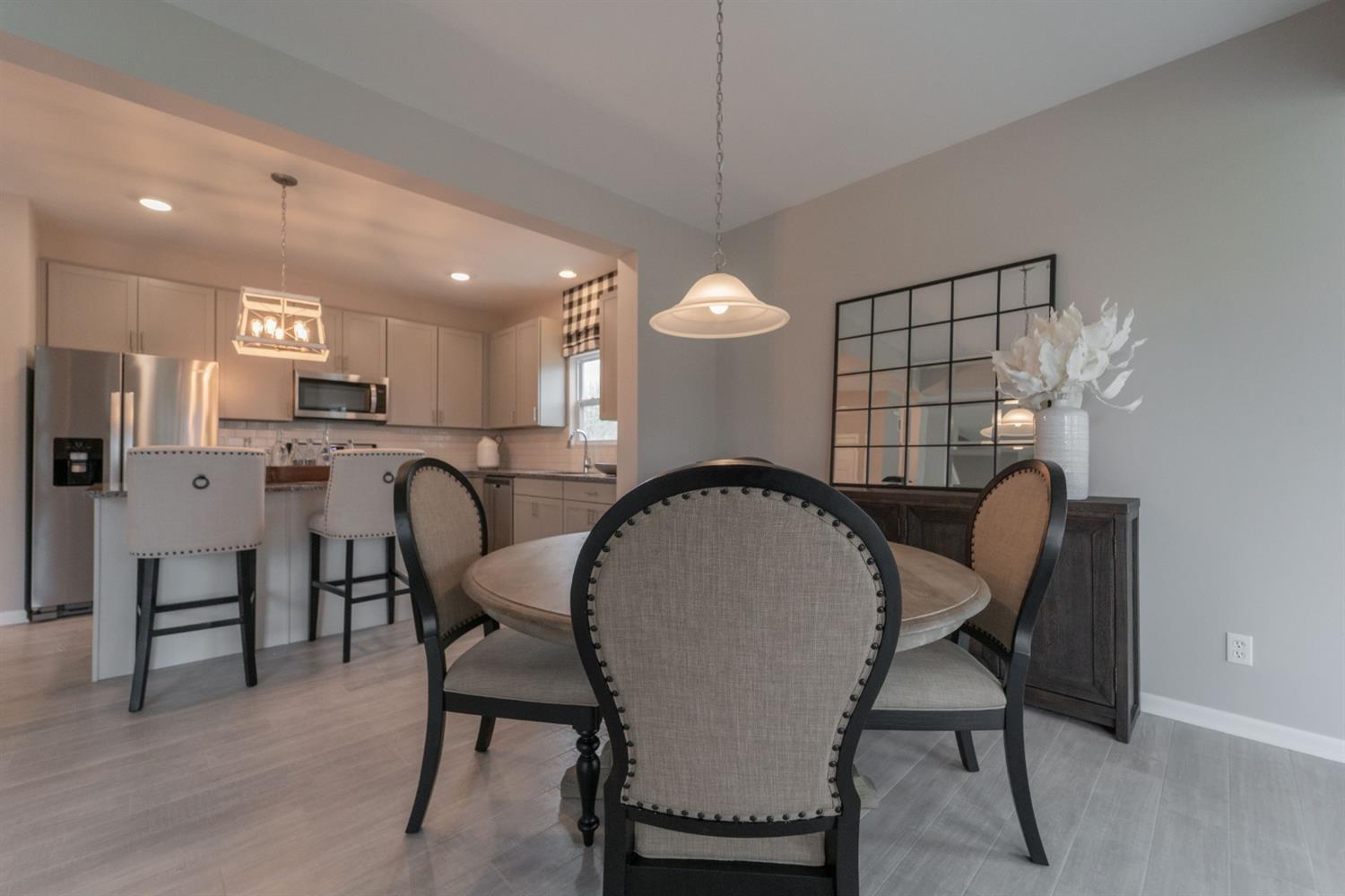 8665 Burr Rdg Circle Crown Point, IN 46307 - Photo 14 of 21 a view of a dining room with furniture and a chandelier