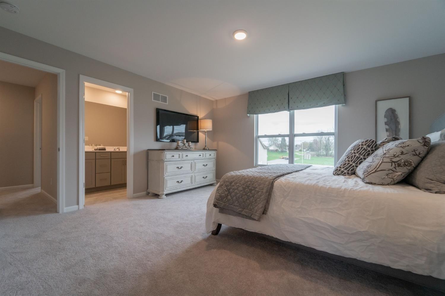 8665 Burr Rdg Circle Crown Point, IN 46307 - Photo 15 of 21 a bedroom with a bed and a window
