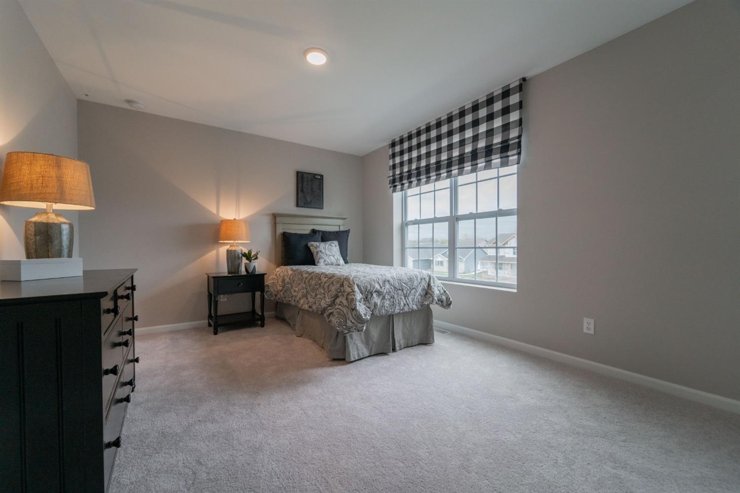 8665 Burr Rdg Circle Crown Point, IN 46307 - Photo 18 of 21 a spacious bedroom with a bed and a window
