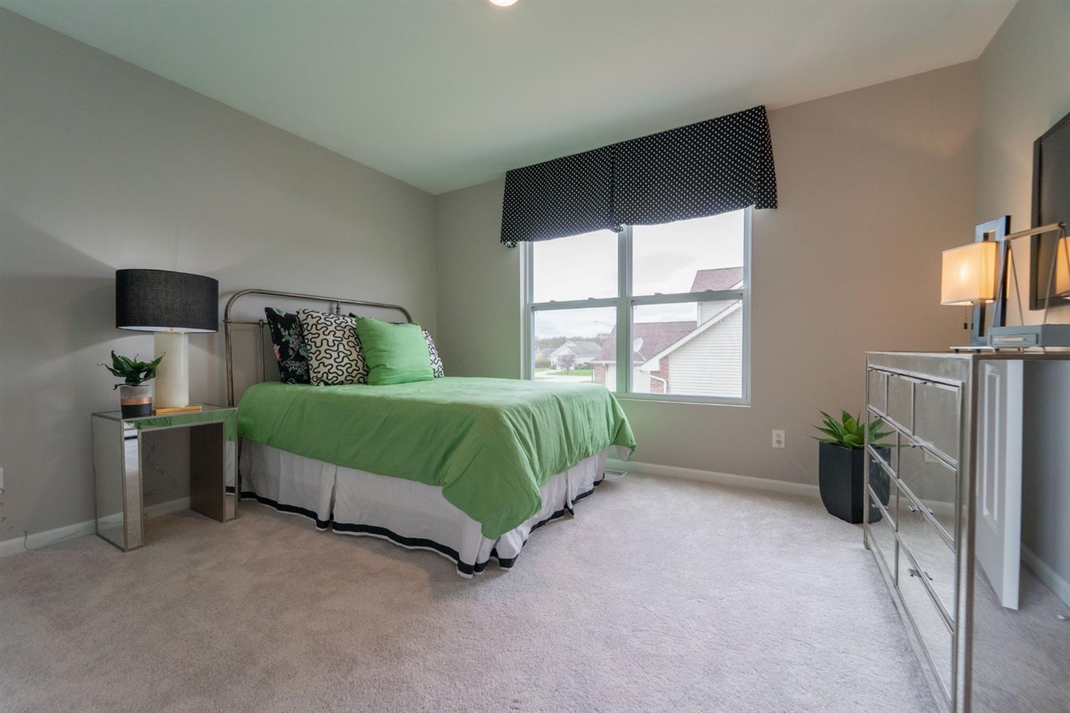 8665 Burr Rdg Circle Crown Point, IN 46307 - Photo 19 of 21 a bedroom with a bed and a window