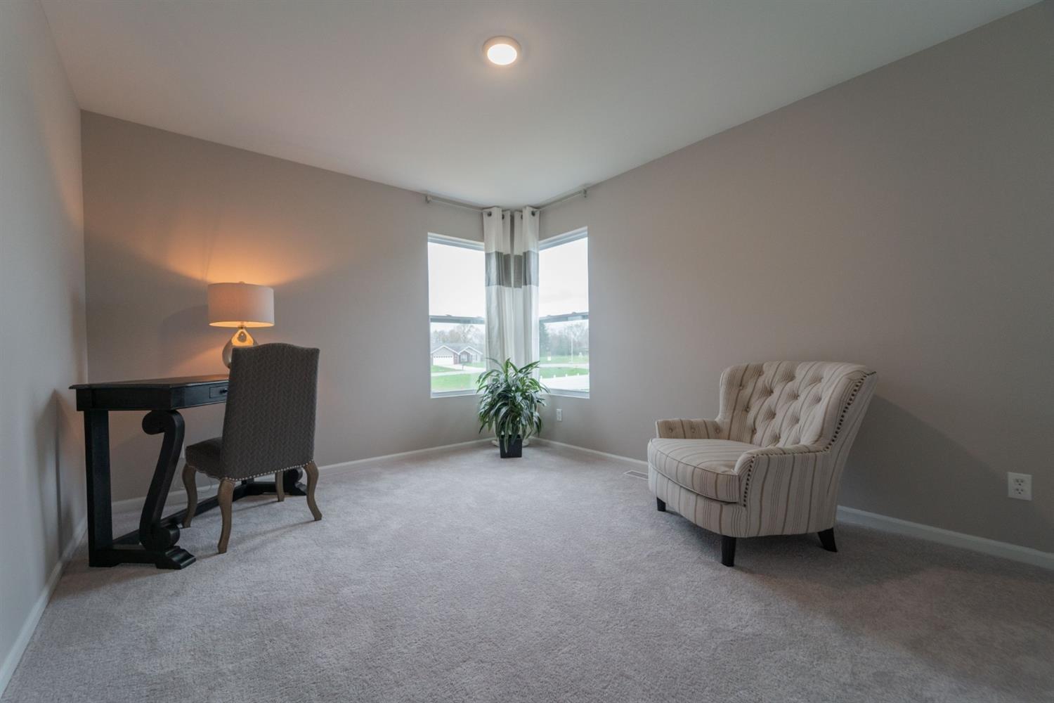 8665 Burr Rdg Circle Crown Point, IN 46307 - Photo 20 of 21 a living room with furniture and a window