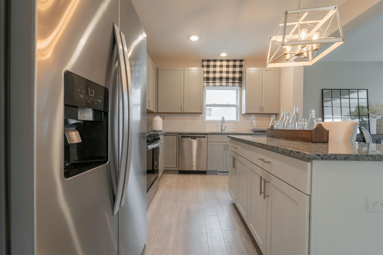 8665 Burr Rdg Circle Crown Point, IN 46307 - Photo 10 of 21 a kitchen with stainless steel appliances a refrigerator sink and cabinets
