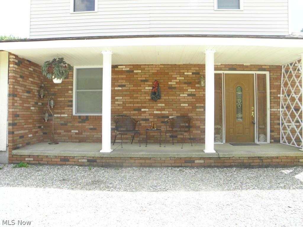 2578 Martin Road Mogadore, OH 44260 - Photo 2 of 25 Comfortable entry to the home, great place to sit in the shade on a hot summer day!
