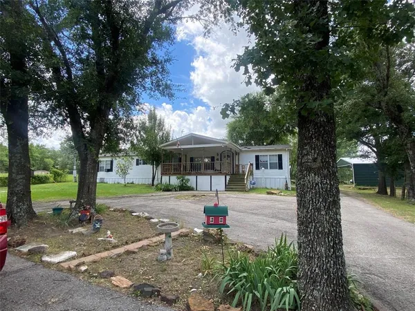 a view of a lake with a yard