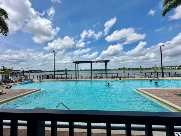 a view of a swimming pool with a yard