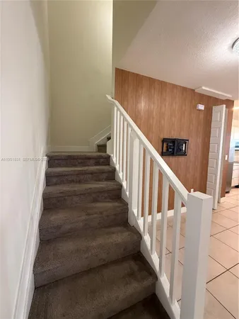 a view of walk in closet and window