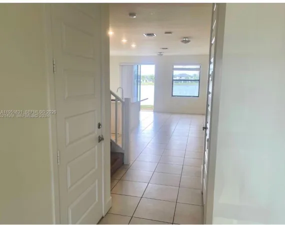 a bathroom with a double vanity sink toilet and shower