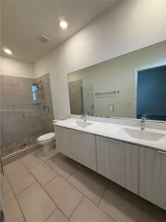 a bathroom with a toilet a sink and bathtub