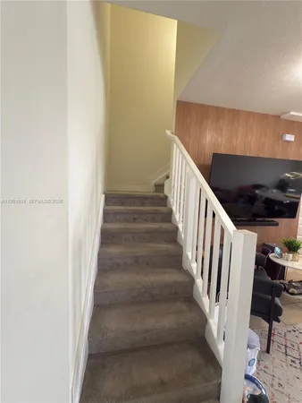 a bathroom with a double vanity sink toilet and shower